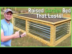 a man is holding up a raised garden bed that has plants growing in it and the words raised garden bed that last