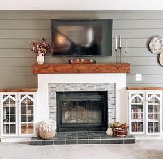 how to decorate around fireplace Farmhouse Fireplace Tile, Wood Stoves Ideas, Farmhouse Style Fireplace, Fireplace With Tv Above, Tile Around Fireplace, Fireplace Tile Ideas, Fireplace With Tv, Cubic Mini Wood Stove, Mantel Styling