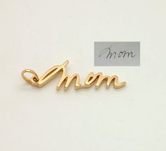 This is a listing for a 14K gold personalized custom charm.Charms are small and generally contain one word/name/signature, approximate size is 0.6-1 inch without clasp.If you need a bigger pendant, please check this listing:https://www.etsy.com/listing/489952651/sympathy-gift-memorial-signature-jewelryThere are different fixtures available how to attach your charm to the bracelet/chain:- Simple loop.Charm will be put on a simple loop that you put a chain through, it fits majority of necklaces, b Personalized 14k Yellow Gold Charms, 14k Gold Personalized Signature Jewelry, Elegant Personalized Charms As A Gift For Mom, Elegant Charms For Anniversary And Mother's Day, Personalized 14k Gold Charms, Elegant Gold Charms For Personalized Gifts, Elegant Personalized Yellow Gold Charms, 14k Gold Stamped Charms For Gift, 14k Gold Charms As A Gift