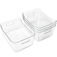 three clear plastic containers with lids on each side and one empty container in the middle