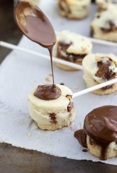 a cookie with chocolate sauce being drizzled onto it