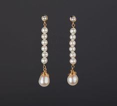 Two tier pearl earring,long pearl string dangle earring,wire-wrapped pearl earring,June birthday gift,anniversary gift,Mother's day gift Good to wear with any dress color or style, this pair of two tier pearl bar / string earrings would be a good birthday gift, or a nice reward for yourself. 1. Stone : fresh water pearl. 2. Stone shape and size: top: a string of small round pearls about 5 mm across and 35 mm in length bottom: a larger oblong (11 x 9 mm) wire-wrapped pearl 3. earring total length White Pearl Linear Earrings Gift, Long Drop Pearl Earrings For Anniversary, Anniversary Long Drop Pearl Earrings, Pearl Linear Long Drop Earrings, Long Drop Pearl Earrings For Gift, Long Drop Pearl Linear Earrings, Pearl White Long Drop Pearl Earrings As Gift, Pearl White Long Drop Pearl Earrings For Gift, Pearl White Long Drop Earrings As Gift