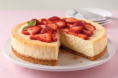 a cheesecake topped with strawberries on a plate