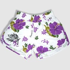 Black shorts with purple hibiscus flower. Made of 100% microfiber polyester. Designed and shipped from Hawaii and made in Vietnam. Colors and fabric may vary from picture depending on cut. Beach Floral Print Stretch Shorts, Stretch Floral Print Beach Shorts, Stretch Floral Print Shorts For Beach, Summer Purple Athletic Shorts With Built-in Shorts, Purple Swimming Shorts For Summer, Stretch Floral Print Shorts For Vacation, White Floral Print Beach Shorts, Purple Beachwear Shorts For Beach Season, White Surfing Shorts