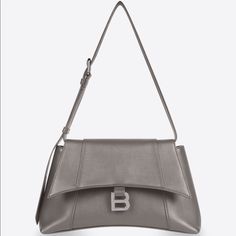 Balenciaga Downtown Small Shoulder Bag, Hourglass Shape, Smooth Semi Shiny, Color: Dark Mink Gray (Kinda On The Brown/Taupe Side In Natural Lighting), 100% Authentic, Never Worn, Comes With Dust Bag. Luxury Gray Shoulder Bag With Dust Bag, Designer Gray Shoulder Bag, Designer Gray Top Handle Shoulder Bag, Luxury Gray Bag With Palladium Hardware, Luxury Gray Shoulder Bag With Palladium Hardware, Designer Gray Leather Shoulder Bag, Luxury Gray Shoulder Bag For Office, Gray Luxury Shoulder Bag For Evening, Classic Gray Shoulder Bag For Evening