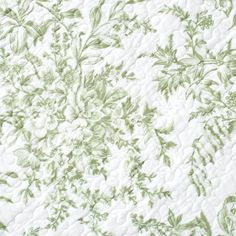 the green and white floral pattern is on this bed sheet