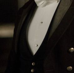 a man in a tuxedo and bow tie