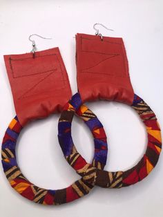 This listing is for a pair of mixed media earrings that are made of leather, fabric and wood. They are approximately 4.5 inches long. Very lightweight. Red Hoop Earrings For Festival, Unique Multicolor Small Hoop Earrings, Handmade Small Brown Hoop Earrings, Handmade Red Drop Earrings, Handmade Brown Small Hoop Earrings, Adjustable Red Hoop Earrings, Unique Handmade Red Hoop Earrings, Unique Brown Hoop Earrings For Gift, Unique Hoop Wrap Earrings For Pierced Ears