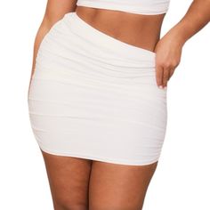 Prettylittlething Shape White Slinky Ruched Side Mini Skirt. Plt Shape Is Designed For Those With An Hourglass Figure, With A Few Curve-Enhancing Tweaks To Give You The Perfect Fit. This Mini Skirt Is Just What You Need For A Weekend-Worthy Finish. It's A Wardrobe Staple That Can Be Easily Styled For Any Occasion. Pull On. Elastic Waist. Ruched Sides Detail. Mini Length. Lightweight Slinky Jersey Knit Fabric. Unlined. Material: 95% Polyester 5% Elastane. Solid White Color. Brand: Prettylittlethi Stretch Ruched Mini Skirt For Night Out, Ruched Stretch Mini Skirt For Night Out, Stretch Mini Skirt With Ruched Sides For Night Out, Ruched Pencil Mini Skirt For Summer, Fitted White Mini Skirt For Daywear, Summer Ruched Pencil Mini Skirt, High Waist Ruched Stretch Mini Skirt, White Stretch Mini Pencil Skirt, Fitted White Mini Skirt With Pockets