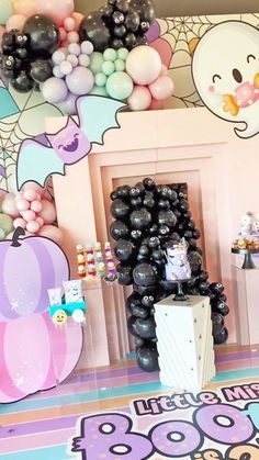 a room with balloons and decorations on the wall