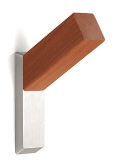 a close up of a wooden object on a white wall with a metal frame and wood top