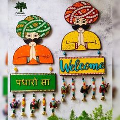 two colorful welcome signs hanging on the wall