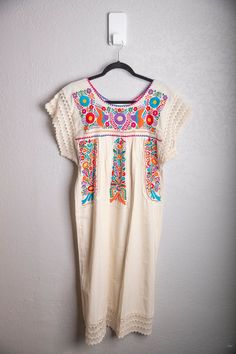 Hand embroidered traditional Mexican Puebla dress with knitted sleeves Traditional Embroidered Dress With Multicolor Sleeves, Folk Style Cotton Dresses With Embroidered Sleeves, Folk Style Multicolor Embroidered Dress For Fiesta, Multicolor Floral Embroidery Dress For Cinco De Mayo, Cotton Dresses With Embroidered Border And Short Sleeves, Embroidered Multicolor Dress For Cinco De Mayo, Bohemian Dress With Multicolor Embroidery And Embroidered Sleeves, Short Sleeve Cotton Dresses With Embroidered Border, Folk Style Embroidered Dress With Multicolor Hem