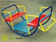 a colorful children's sleigh sitting on the ground