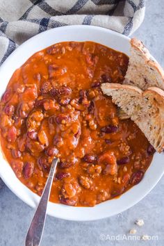 a white bowl filled with chili and bread