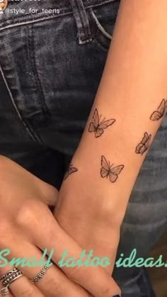 a woman's arm with butterflies on it and the words simply tattoos ideas written below