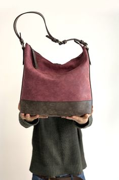 This hobo bag is made of high quality vegan leather in burgundy and dark brown. It is soft and lightweight but durable. It has a rustic, distressed look. It has two interior pockets and a zippered exterior pocket. It has a slouchy silhouette and plenty of room for your daily needs. Measurements: 31 x 30 x 13 cm IMPORTANT! Your orders between 7-25 August will be shipped on August 28. Delivery takes 2-5 days to the US, Canada, Australia and Europe; in 3-7 days to rest of the world after shipping. Burgundy Purse, Vegan Purses, Purple Backpack, Purple Bag, Convertible Bags, Brown Handbag, August 28, Leather Hobo Bag, Purple Bags