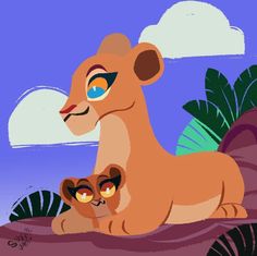 the lion and cub are sitting together in the jungle