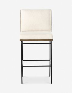 an upholstered bar stool with a black frame and beige fabric seat padding