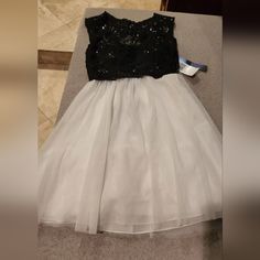 Beautiful Black And White Dress For Party Or Special Events Or Weddings Tag Size 5 Juniors (Xsmall). Waist 24-25 And Bust 15 Inches White Dressy Prom Dress, Black Holiday Prom Dress, Black Dress For Spring Dress-up, Black Spring Dress-up Dresses, Elegant Mini Dress For Dress-up, White Fitted Mini Dress For Dress-up, Black Dressy Dresses For Prom Season, Dressy White Party Dress, Dressy Black Dresses For Prom Season