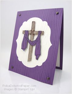 a purple and white card with a cross on it