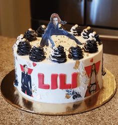 a decorated birthday cake sitting on top of a counter