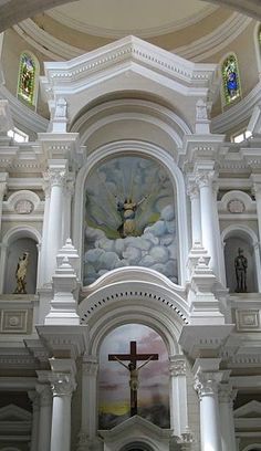 the interior of a church with an ornate alter