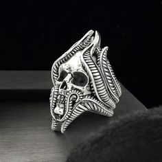 Embrace the edgy and bold style with our Skull Ring, expertly crafted from high-quality 925 Sterling Silver. This striking ring features a detailed skull design, symbolizing strength, power, and rebellion. Each piece is meticulously handmade, ensuring exceptional craftsmanship and attention to detail, making every ring unique and of the highest quality. Perfect for both men and women, this statement ring adds a touch of gothic elegance to any outfit, whether for everyday wear or special occasion Silver Skull Ring For Halloween Streetwear, Silver Punk Rings For Streetwear, Punk Skull Ring For Halloween Streetwear, Punk Skull Ring For Streetwear, Edgy Silver Rings For Streetwear, Masonic Ring, Viking Ring, Retro Ring, Animal Rings