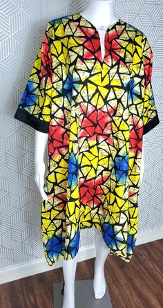 This beautifully crafted kaftan dress features a colorful colorblock pattern, with asymmetrical Ruffles sleeves and a unique button accent. The dress has a round neckline and is closed with a button, making it perfect for a variety of occasions such as travel, weddings, parties, casual or formal events, and workwear.  The dress is made from high-quality polyester material, which is machine washable for easy care. It's available in size M, and L and is handmade, perfect for women who appreciate u Multicolor Printed Dress With Asymmetrical Hem, Multicolor Asymmetrical Dress With Print, Multicolor Cotton Dress With Abstract Print, Multicolor Abstract Print Cotton Dress, Oversized Multicolor Patchwork Dress, Oversized Multicolor Summer Dress, Multicolor Printed Short Sleeve Kaftan, Casual Multicolor Dresses With Kimono Sleeves, Casual Multicolor Tunic Kaftan