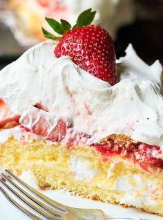 a slice of strawberry shortcake with whipped cream and strawberries on top, ready to be eaten