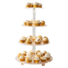 three tiered cake stand with cupcakes on it