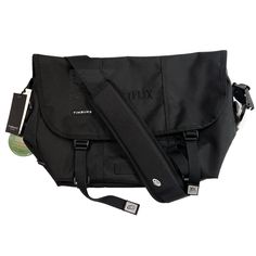 Timbuk2 Netflix Classic Messenger Bag Eco Black Black Camera Bag For Daily Use, Black Camera Bag With Detachable Strap For Daily Use, Urban Black Shoulder Bag With Adjustable Strap, Black Urban Shoulder Bag With Adjustable Strap, Functional Black Rectangular Shoulder Bag, Everyday Casual Black Camera Bag, Casual Everyday Black Camera Bag, Black Tote Bag For Commuting, Modern Black Bags For Commuting