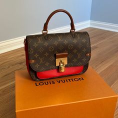 This Is An Authentic Louis Vuitton Monogram Vaugirard In Coquelicot. The Bag Is Crafted Of The Iconic Monogram Canvas With A Red Leather Front Pocket And Sides. The Bag Features An Adjustable Shoulder Strap, Polished Gold Hardware, And A Brown Rolled Leather Handle. The Front Flap Opens To A Partitioned Red Microfiber Interior With A Central Flat Compartment. Base Length: 10.25 In Height: 6.75 In Width: 3.50 In Drop: 3.50 In Drop: 12.50 In Drop: 20.50 In Comes With Dust Bag Strap Box Designer Monogram Canvas Flap Bag With Top Handle, Designer Monogram Canvas Top Handle Flap Bag, Designer Top Handle Flap Bag In Monogram Canvas, Luxury Flap Bag With Detachable Strap For Errands, Monogram Canvas Satchel Flap Bag With Gold-tone Hardware, Luxury Satchel Flap Bag For Errands, Shopping Flap Bag With Top Handle In Monogram Canvas, Designer Monogram Canvas Flap Bag With Detachable Strap, Designer Monogram Canvas Flap Bag