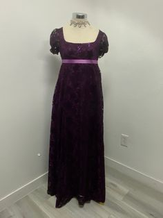 Beautiful dark purple lace over lilac polyester lining dress perfect for your regency ball or tea party this lace on this dress have sequins that makes it shine, as you will shine and turn heads your way wearing this dress, please note it takes me 5-8 business days to produce and ship after you place order  THERE IS NO RETURNS OR EXCHANGES ACCEPTED  PLEASE BE SURE TO CHECK THE MEASUREMENTS ON THE BOTTOM OF THE DESCRIPTION. If for any reason the measurements don't  match with yours be sure to pro Regency Dress Purple, Victorian Floor-length Dress For Party With Fitted Bodice, Victorian Floor-length Party Dress With Fitted Bodice, Elegant Victorian Dress With Lace Trim For Party, Red Regency Dress, Floor-length Victorian Dress For Party, Fitted Victorian Ball Gown For Prom, Victorian Ball Gown With Fitted Bodice For Parties, Elegant Victorian Ball Gown For Evening