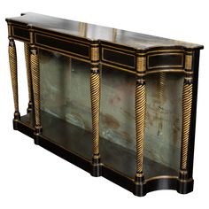 a black and gold sideboard with glass doors