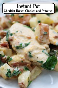 a white plate topped with potatoes and spinach covered in cheese, chicken and sauce