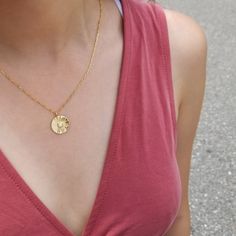 "An opalescent center stone adds to the striking found-object aesthetic of a sunburst-etched coin pendant necklace. ♥ Measurement of pendant: 18 mm tall and width (gold plated) ♥ Available in 16\", 18\", 20\", 22\" and 24\" figaro chain length (gold plated on the top of 925 sterling silver) ♥ Width of figaro chain: 1.5 mm ♥ Spring ring clasp ♥ Nickel free ♥ All items are packed inside an elegant Gold Spoon jewelry box. If you are purchasing a product to send as a gift, we can send the product di Figaro Chain Jewelry With Round Pendant As Gift, Medallion Necklace With Satellite Chain As A Gift, Round Satellite Chain Jewelry As Gift, Pendant Necklace With Figaro Chain As Gift, Round Coin Necklace With Figaro Chain As Gift, Figaro Chain Pendant Necklace As Gift, Figaro Chain Necklace With Medallion As Gift, Figaro Chain Charm Necklace As A Gift, Medallion Clavicle Chain Necklace For Gift