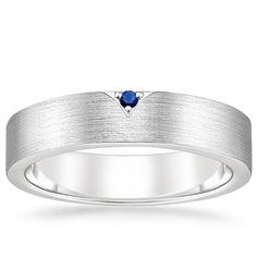 Men's Platinum Andreas Sapphire Ring Wedding Ring. A single, shining sapphire gleams from a chevron-inspired impression in this classic yet unique ring. A matte-brushed band adds a handsome elegance while smooth edges allow for sleek comfort. Male Wedding Bands Sapphire, Men’s Wedding Band With Sapphire, Men’s Sapphire Wedding Band, Sapphire Wedding Band Men, Mens Sapphire Wedding Band, Platinum Ring Men, Blue Sapphire Wedding Band, Future Board, Sapphire Wedding Ring