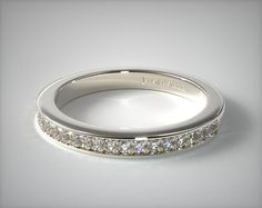 a white gold wedding band with channel set diamonds