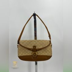 Louis Vuitton Marjorie Bag Beige Mini Lin Lv Monogram With Tan Leather Trim And Gold Hardware Date Code:Th1024 Approx 10x2x6.5” Strap Drop Is Approx 7”- Removable But Not Adjustable Double Flap Interior 2 Large Compartments With No Pockets Functional Front Closure Item Shows Signs Of Wear From Normal Use- Staining On Interior & Exterior, Dirty; Scratches And Scuffs On Leather Trim, Dents On Front Closure Etc Please Refer To Photos For Further Details In Store And Website For $390 Zeb82778 Monogram Canvas Shoulder Baguette Bag For Travel, Vintage Beige Shoulder Bag With Branded Hardware, Vintage Beige Coated Canvas Shoulder Bag, Monogram Canvas Satchel Shoulder Bag With Gold-tone Hardware, Everyday Monogram Canvas Flap Bag With Gold-tone Hardware, Monogram Canvas Flap Bag With Gold-tone Hardware, Beige Monogram Canvas Shoulder Bag With Adjustable Strap, Brown Monogram Canvas Baguette Bag, Beige Coated Canvas Shoulder Bag With Branded Hardware