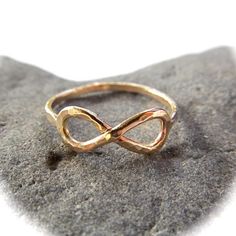 Infinity Symbol Ring~ This is a Custom ordered Infinity ring made for you in 14k gold fill. Each ring is hand forged, hammered and polished to a beautiful shine. This would make a great bridesmaid, friendship or anniversary gift! *This listing is for 1 infinity ring made with 14k gold fill 16 gauge wire* **This ring is thinner than our other rings and can be made thicker upon request** Each ring is a one of a kind, hand shaped and hammered and will vary Also available in sterling silver~ https:/ Surfer Girl Gifts, Gold Infinity Ring, Crystal Point Necklace, Friendship Rings, Hammered Rings, Infinity Ring, Wedding Bridal Jewellery, Infinity Symbol, Thumb Rings