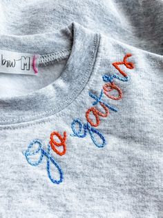 a close up of a t - shirt with the word google embroidered on it's chest