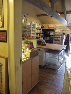 the inside of a store with shelves and baskets