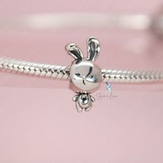 This is charm only, bracelet is sold separatelyIndulge in the adorable charm of our sterling silver rabbit bead charm! Made with solid 925 sterling silver and coated in platinum, these charms are guaranteed to be sturdy and intricately designed. Whether you're adding to your current charm bracelet or starting a new one from our collection, these charming bunny animal charms are a must-have for any lover of cute and stylish jewelry. Material: 925 sterling silverFinish: platinum plateDimension: 0. Cute Silver Charms For Gifts, Cute Silver Dangle Charms, Silver Bunny Design Jewelry For Gifts, Silver Bunny Design Jewelry Gift, Silver Jewelry With Bunny Design For Gift, Rabbit Charm, Cute Rabbit, Stylish Jewelry, Sterling Silver Charm