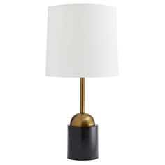 a black and gold table lamp with a white shade on the top, against a white background