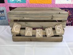 a wooden crate sitting on top of a white table