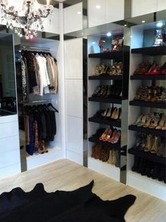 the closet is full of shoes and other items in it, including a chandelier