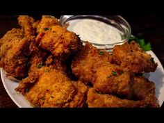 fried chicken on a plate with ranch dressing