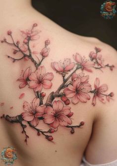 a woman's back with pink flowers on it