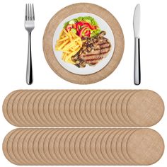 a plate with steak, french fries and salad on it next to placemats